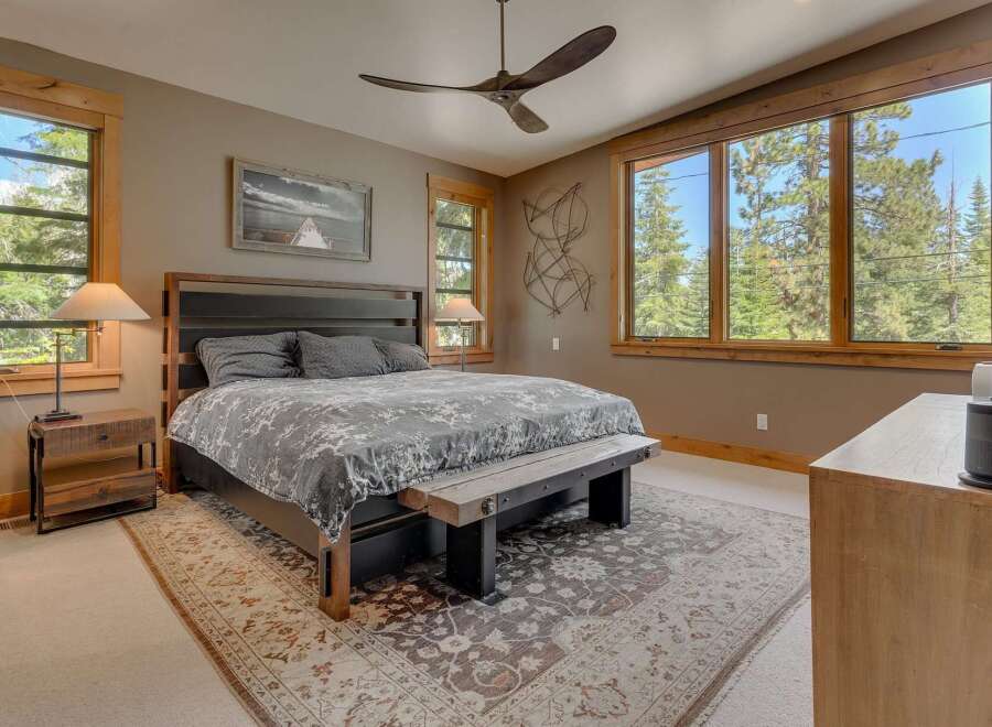 This stunning bedroom boasts a blend of rustic charm and modern elegance.