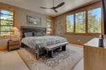 This stunning bedroom boasts a blend of rustic charm and modern elegance.