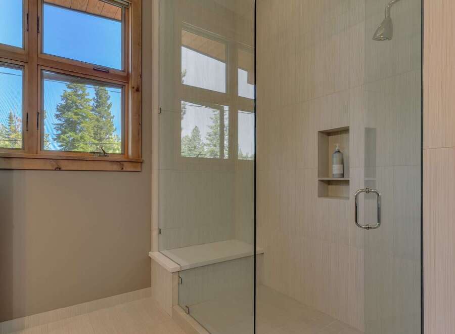 Step into a luxurious bathroom with a modern shower design.