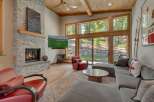Experience luxury living in this stunning property featuring a cozy fireplace and a spacious living area.