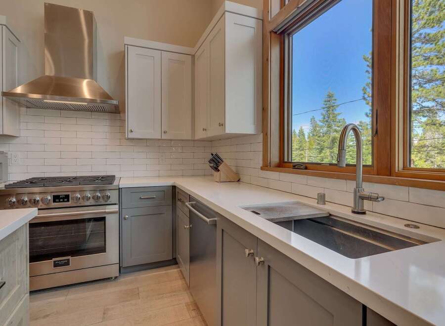 This stunning kitchen boasts modern design and high-end appliances, perfect for culinary enthusiasts.