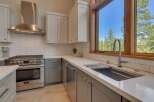 This stunning kitchen boasts modern design and high-end appliances, perfect for culinary enthusiasts.