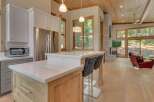 This stunning kitchen boasts a modern design with sleek countertops and stainless steel appliances.