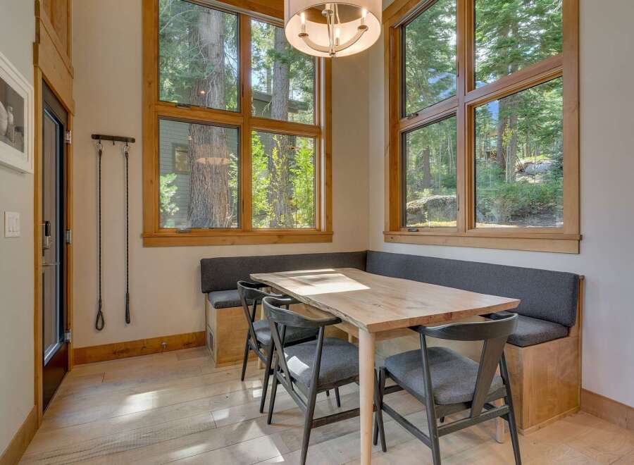 This stunning dining area boasts a modern design with a touch of rustic charm.