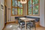 This stunning dining area boasts a modern design with a touch of rustic charm.