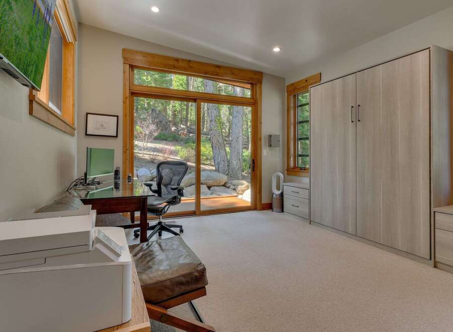 This stunning home office boasts a serene ambiance, perfect for productivity and relaxation.