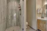 Step into luxury with this stunning bathroom! Featuring a beautifully tiled shower with a glass door, this space exudes modern elegance.