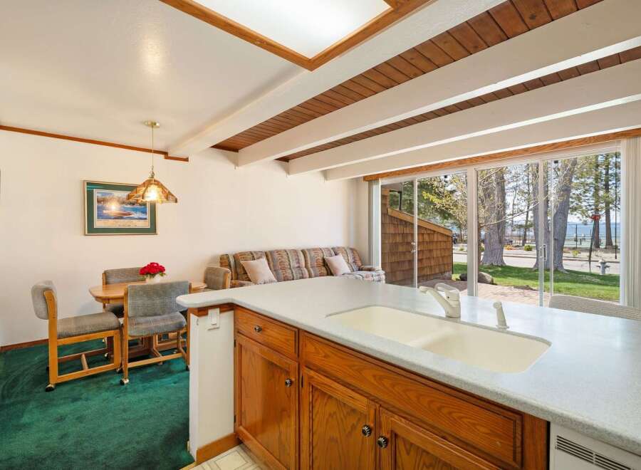 This stunning property boasts a bright and airy kitchen with a spacious countertop and ample cabinet space, perfect for culinary enthusiasts.