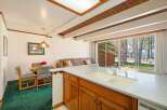 This stunning property boasts a bright and airy kitchen with a spacious countertop and ample cabinet space, perfect for culinary enthusiasts.
