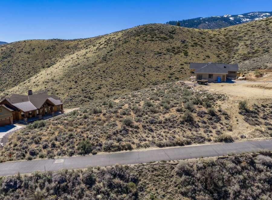 Discover your dream home nestled in the serene beauty of the mountains.