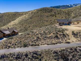Discover your dream home nestled in the serene beauty of the mountains.