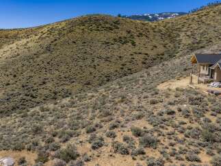 Nestled in the heart of nature, this stunning property offers breathtaking views of the surrounding landscape.