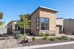 Discover modern living in this stunning property! This home boasts a contemporary design with a beautiful facade featuring stone accents and large windows.