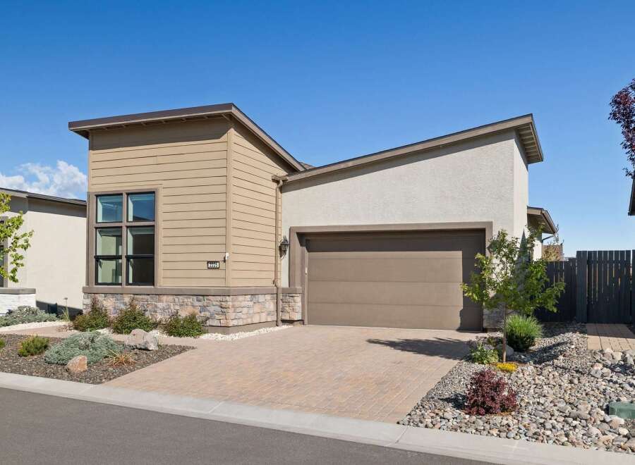 This stunning property boasts a modern design with a beautiful exterior.