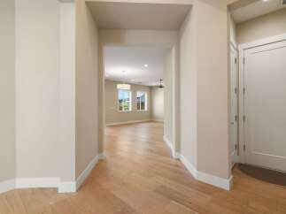 Step into this beautifully designed home and be greeted by a warm and inviting entryway.