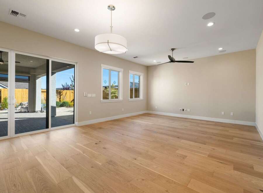 Step into this stunning, light-filled room featuring beautiful hardwood floors and a modern design.
