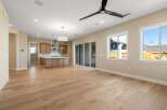 Step into this stunning open-concept living space, featuring beautiful hardwood floors and abundant natural light.