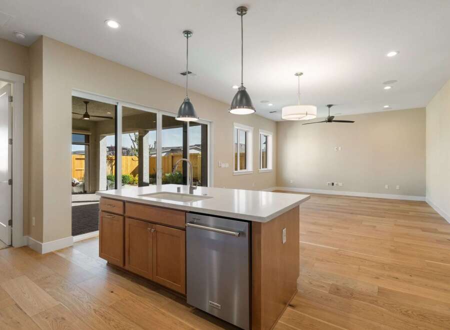 This stunning kitchen boasts a modern design with a spacious island, perfect for meal preparation and entertaining.