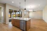 This stunning kitchen boasts a modern design with a spacious island, perfect for meal preparation and entertaining.