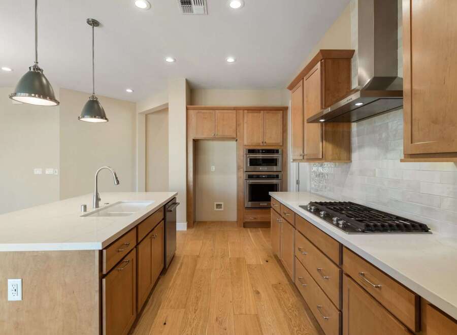 This stunning kitchen boasts modern design and high-end appliances, perfect for culinary enthusiasts.