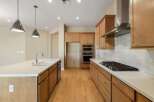 This stunning kitchen boasts modern design and high-end appliances, perfect for culinary enthusiasts.