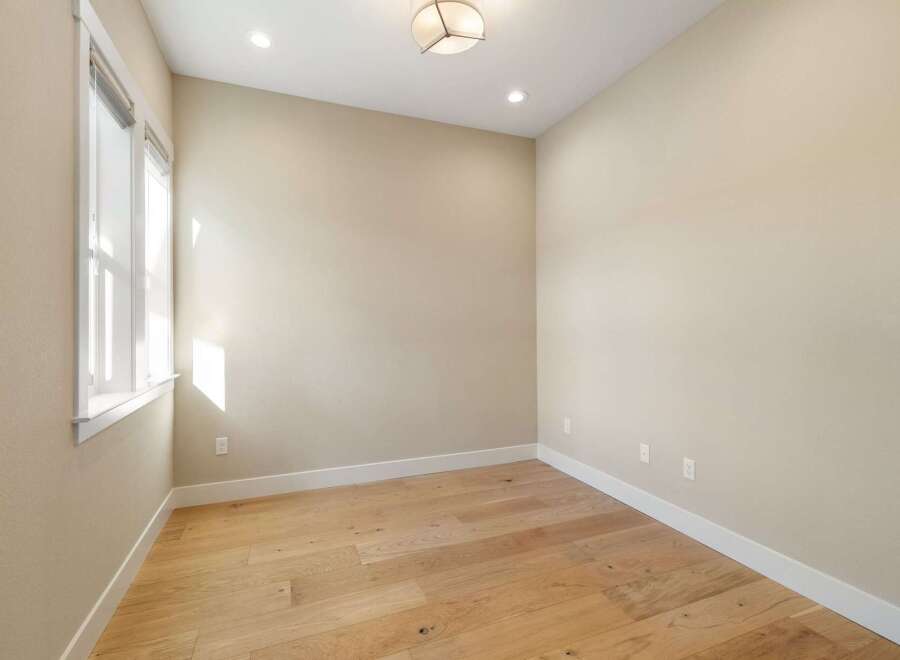 This inviting room showcases beautiful hardwood floors and neutral walls, creating a versatile space ready for your personal touch.