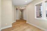 Step into this inviting space, showcasing beautiful hardwood floors that flow throughout.