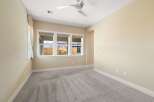 Step into this bright and airy bedroom, featuring a neutral color palette and plush carpeting.