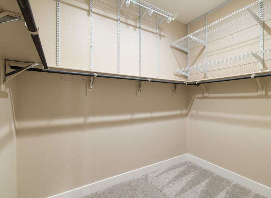 Step into this well-organized closet, designed for optimal storage and easy access.