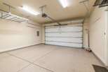 This spacious garage offers ample room for parking and storage.