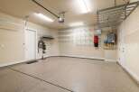This spacious garage offers ample storage and functionality.