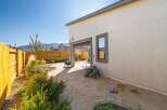 Discover the charm of this stunning property, featuring a beautifully landscaped backyard with a serene patio area.