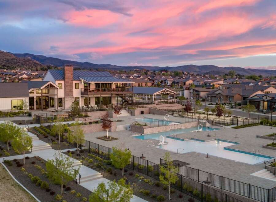 Discover luxury living at this stunning property, featuring a beautiful community pool and modern architecture.