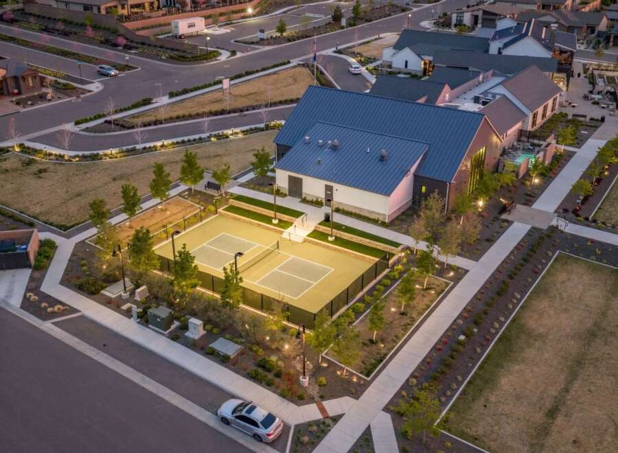 Discover luxury living at this stunning property, featuring a state-of-the-art pickleball court for active residents.