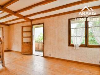 Discover the charm of this inviting property, featuring a warm wooden floor and exposed beams that create a cozy atmosphere.