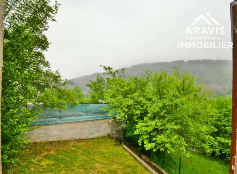 Discover a serene property nestled amidst lush greenery and breathtaking mountain views.