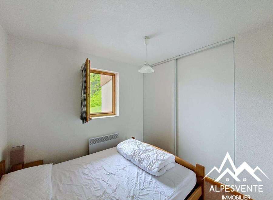 Discover a cozy bedroom with natural light and a serene ambiance.