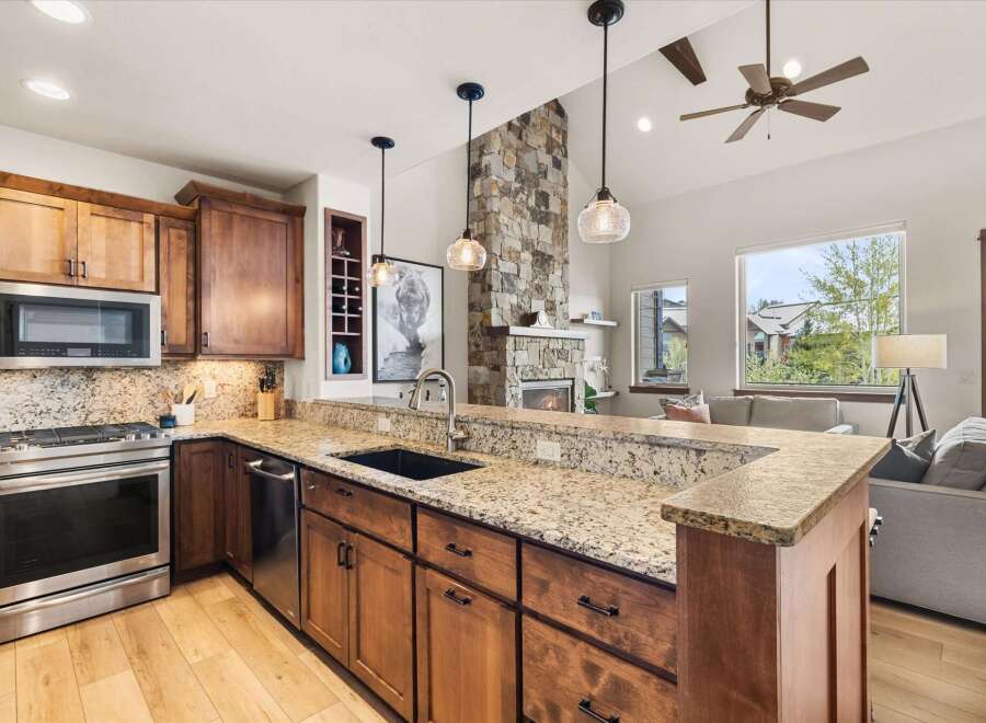 Step into luxury with this stunning kitchen, featuring custom cabinetry, granite countertops, and stainless steel appliances.