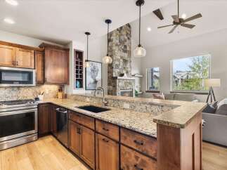 Step into luxury with this stunning kitchen, featuring custom cabinetry, granite countertops, and stainless steel appliances.