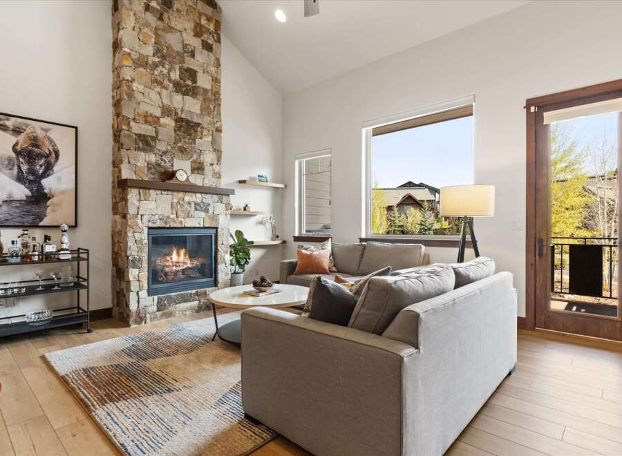 Experience luxury living in this stunning property featuring a cozy fireplace and a spacious living area.