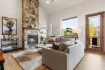 Experience luxury living in this stunning property featuring a cozy fireplace and a spacious living area.