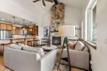 This stunning property boasts a cozy living room with a stone fireplace, perfect for relaxing evenings.