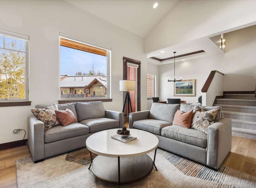Step into luxury with this stunning living room, featuring a modern design and ample natural light.