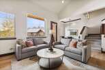Step into luxury with this stunning living room, featuring a modern design and ample natural light.