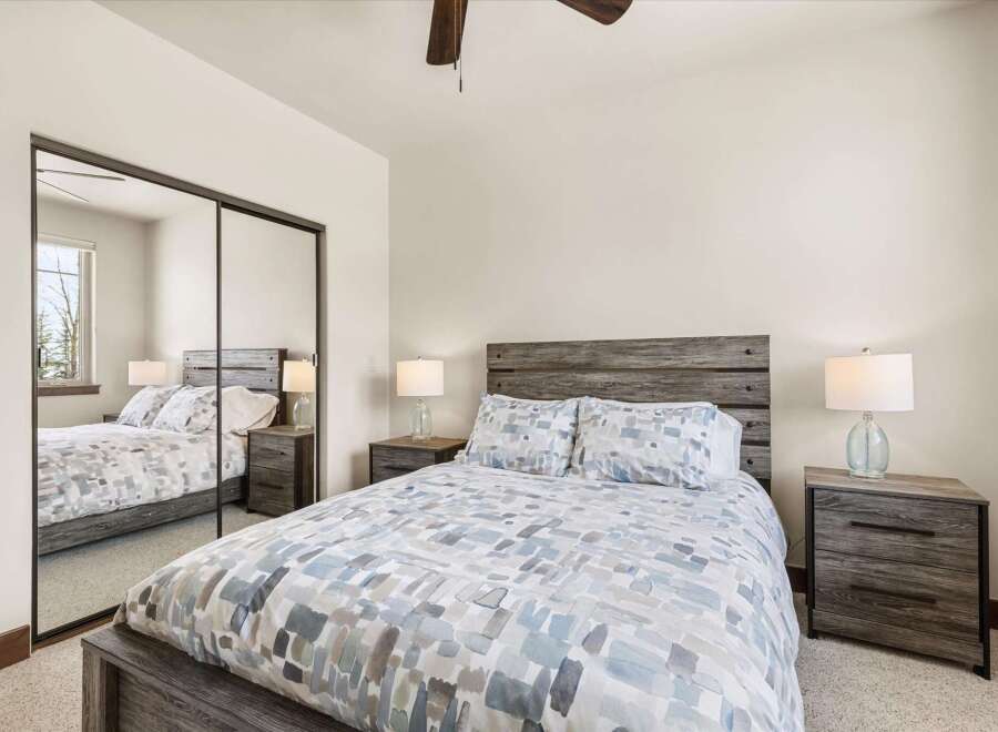 This stunning bedroom features a modern design with a rustic touch, perfect for a relaxing retreat.