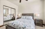 This stunning bedroom features a modern design with a rustic touch, perfect for a relaxing retreat.