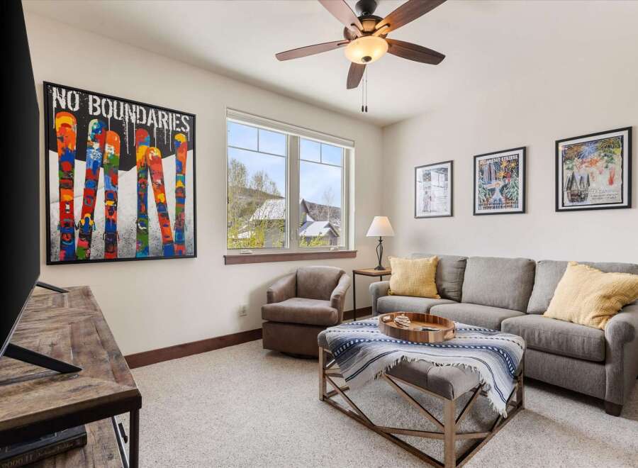 This inviting living space boasts a cozy atmosphere, perfect for relaxation and entertainment.