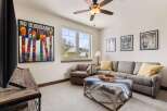 This inviting living space boasts a cozy atmosphere, perfect for relaxation and entertainment.