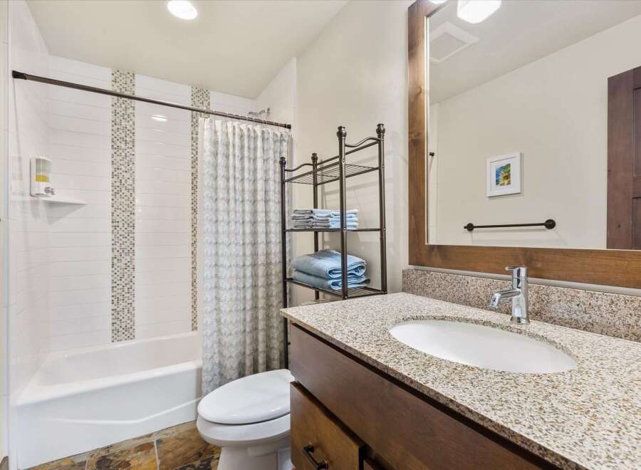 This stunning bathroom boasts a modern design with a touch of elegance.