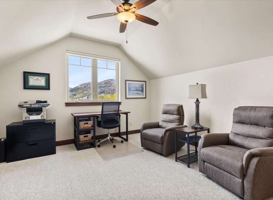 This cozy home office offers a serene workspace with stunning mountain views.